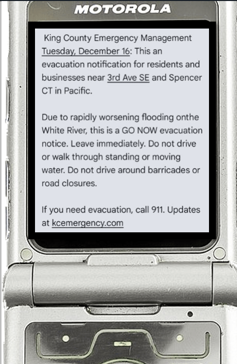 Image of a phone showing a text message similar to what some residents received if they were in an area affected by flooding. 